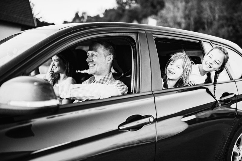 Family driving by car